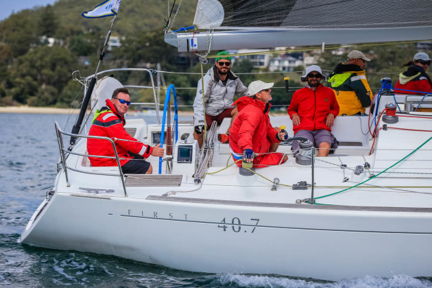 L'Attitude Jon Short on the helm at Sail Port Stephens. Photo Saltwater Images.